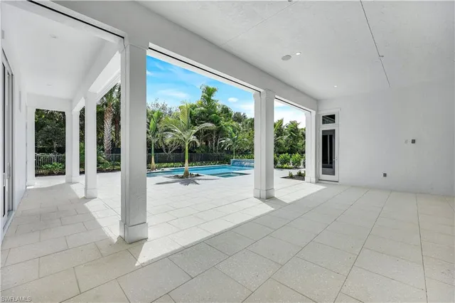a view of a backyard with swimming pool