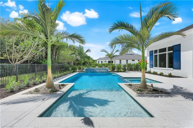 an aerial view of city and lake