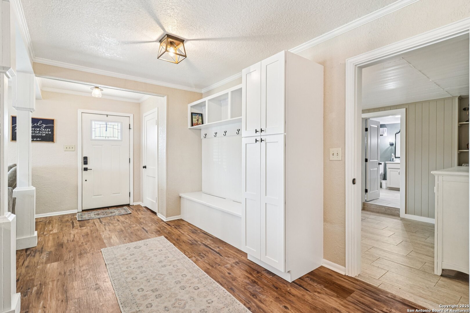 100 North Carroll Street Poth, TX 78147 - Photo 12 of 58 a view of a hallway with wooden floor and a livingroom view