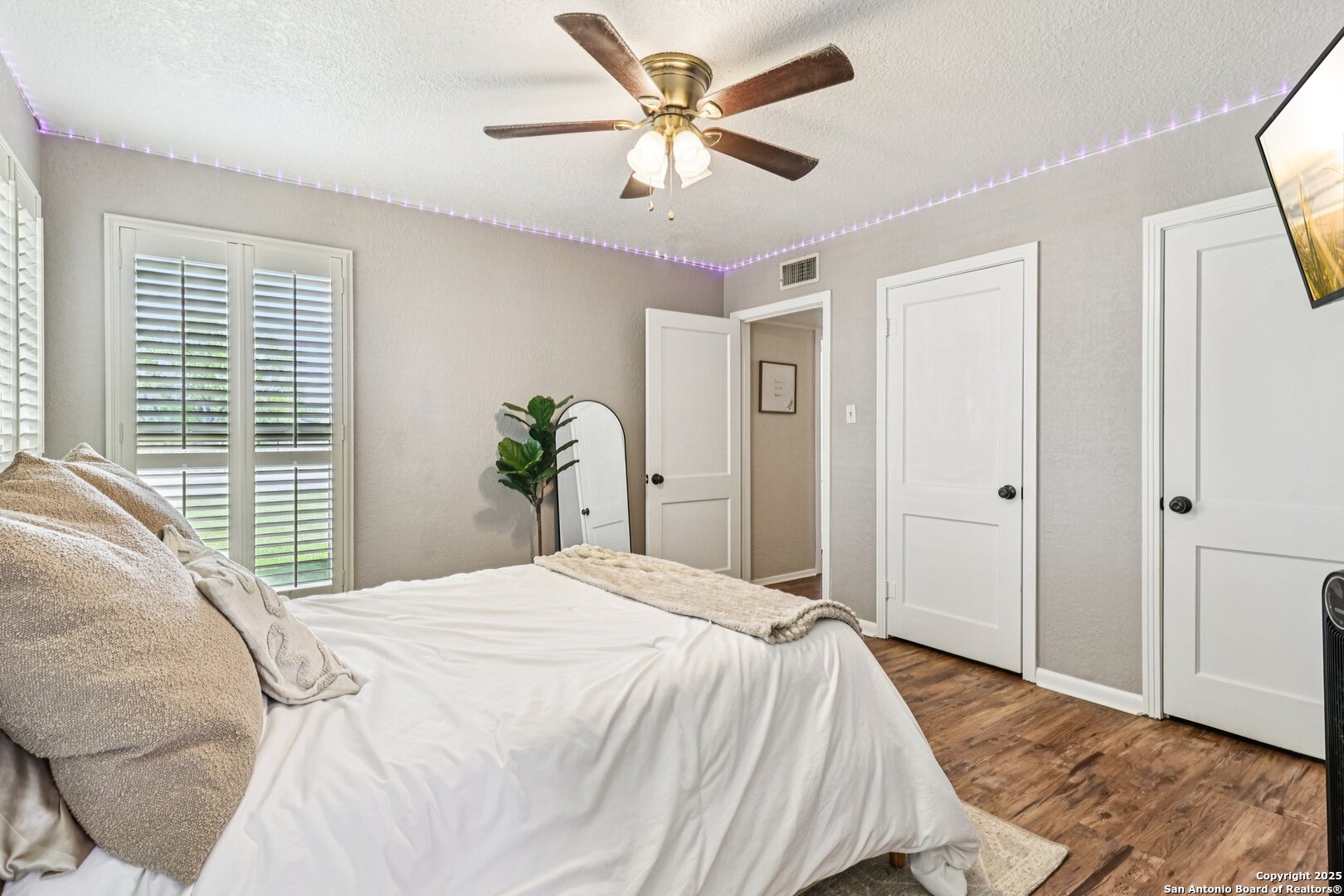 100 North Carroll Street Poth, TX 78147 - Photo 27 of 58 a bedroom with a bed and a large window