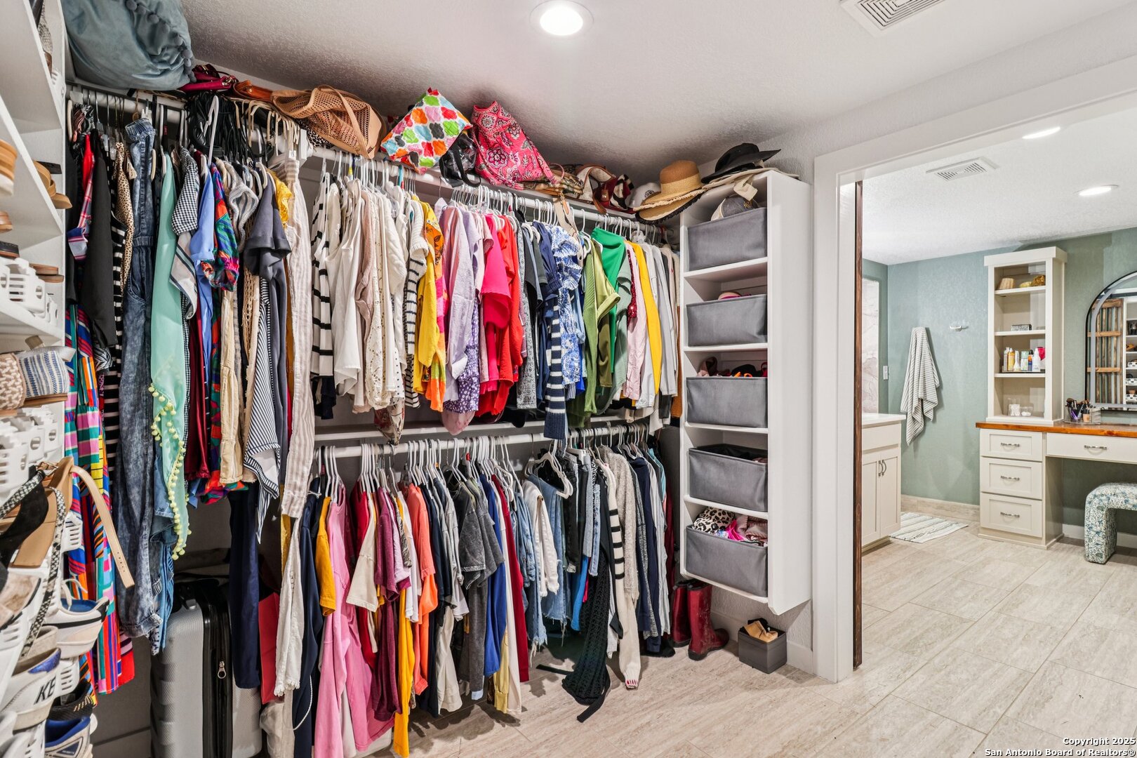 100 North Carroll Street Poth, TX 78147 - Photo 39 of 58 a view of walk in closet with clothes