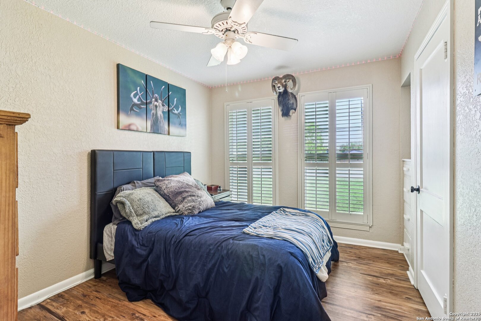 100 North Carroll Street Poth, TX 78147 - Photo 44 of 58 a bedroom with a large bed and a window