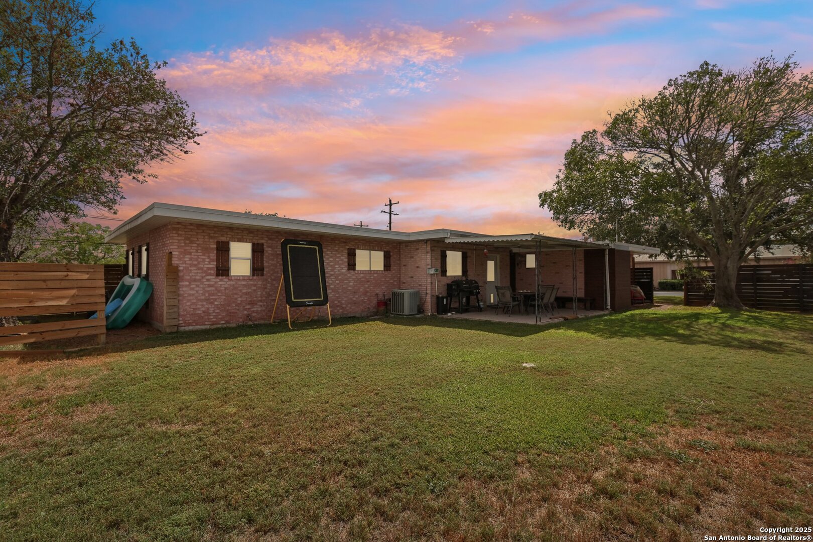 100 North Carroll Street Poth, TX 78147 - Photo 6 of 58 a front view of a house with a garden