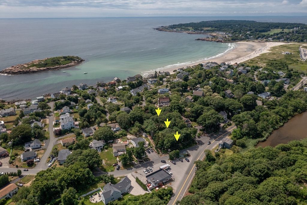 143 Thatcher Road Gloucester, MA 01930 - Photo 6 of 23 a view of a lake with a mountain and trees
