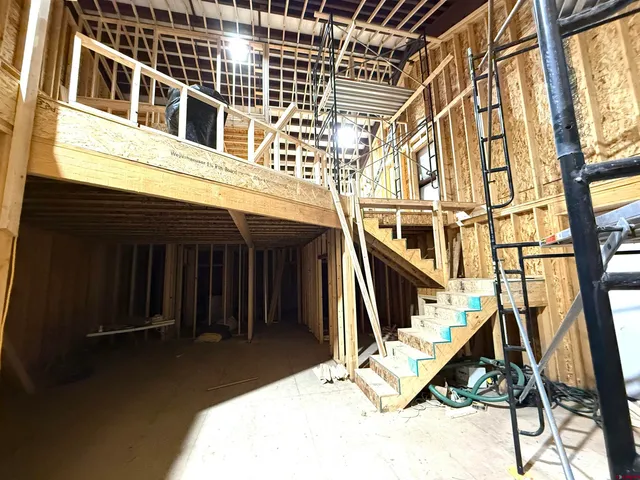 a view of a door with a table and chair