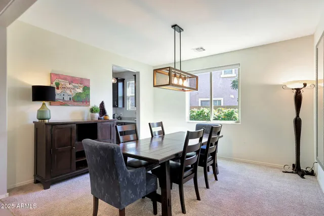 a kitchen with a table and chairs