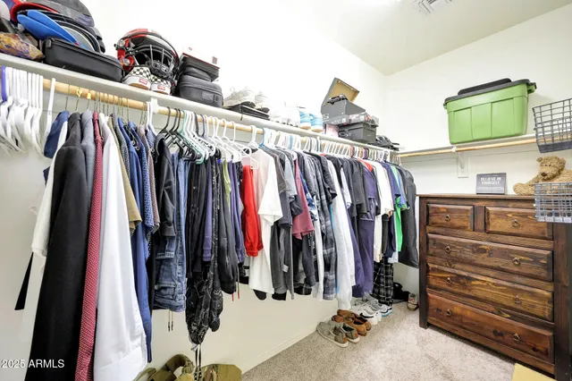 a bedroom with a bed couch and window