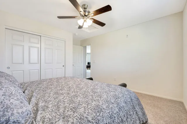 a front view of a house with a yard and patio