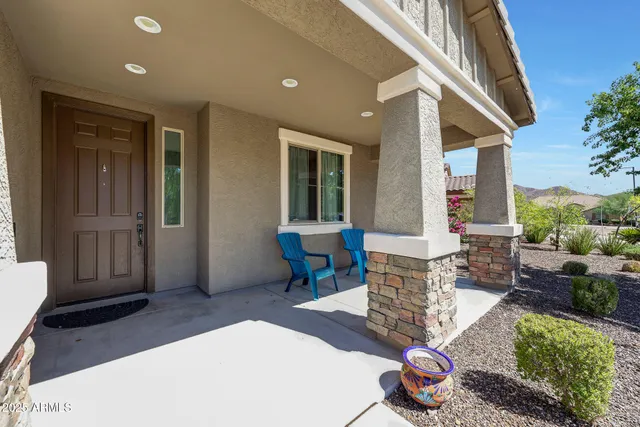 a living room with furniture windows and a wooden floor