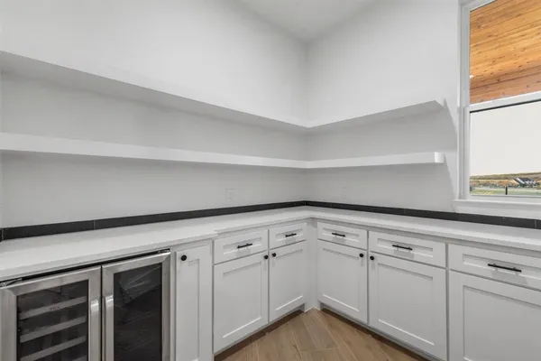 a view of a kitchen with cabinets