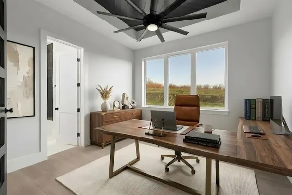 a view of a workspace with furniture