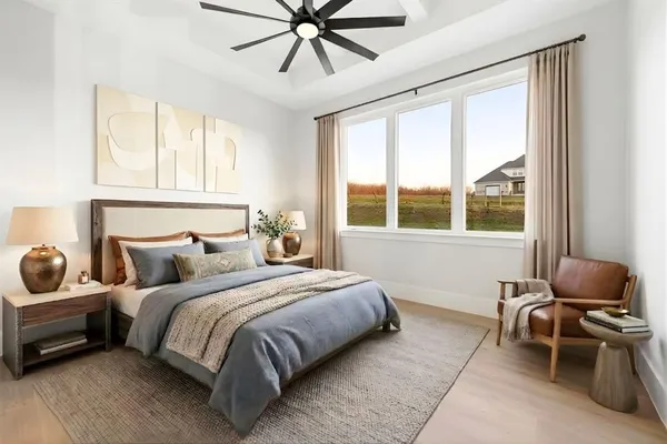 a bedroom with a bed and windows