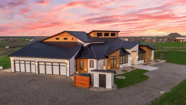 a view of a house with a big yard