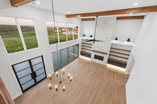 a view of a living room with furniture and windows
