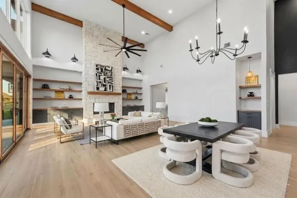 a living room with furniture and a chandelier