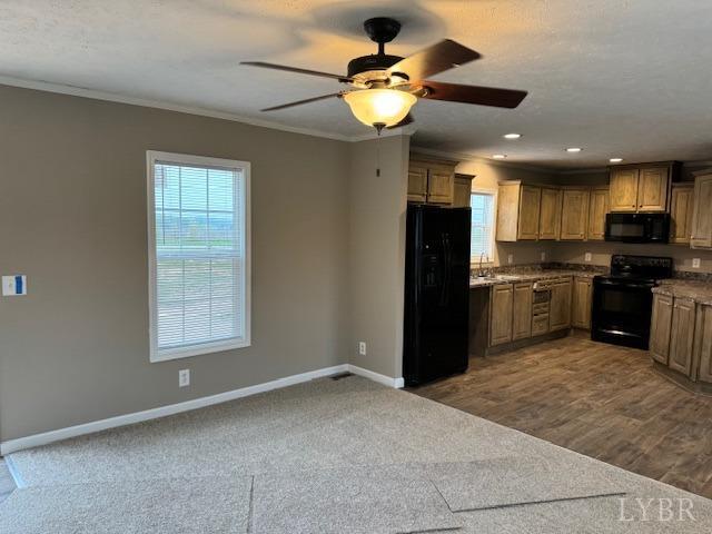 2079 Nursery Road Pamplin, VA 23958 - Photo 4 of 15 a kitchen with stainless steel appliances granite countertop a refrigerator a sink a stove a microwave and island with wooden cabinets