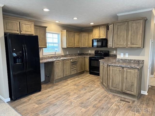 2079 Nursery Road Pamplin, VA 23958 - Photo 5 of 15 a kitchen with stainless steel appliances granite countertop a stove top oven a sink dishwasher and a refrigerator with wooden cabinets