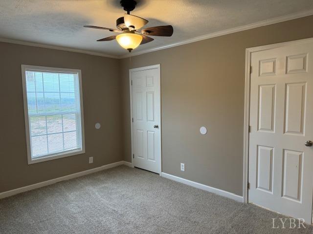 2079 Nursery Road Pamplin, VA 23958 - Photo 7 of 15 an empty room with windows and chandelier fan
