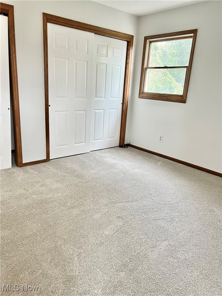 15317 Strader Road East Liverpool, OH 43920 - Photo 21 of 23 Unfurnished bedroom featuring light colored carpet and a closet