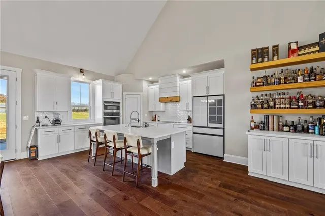 a kitchen with a cabinets and wooden floor