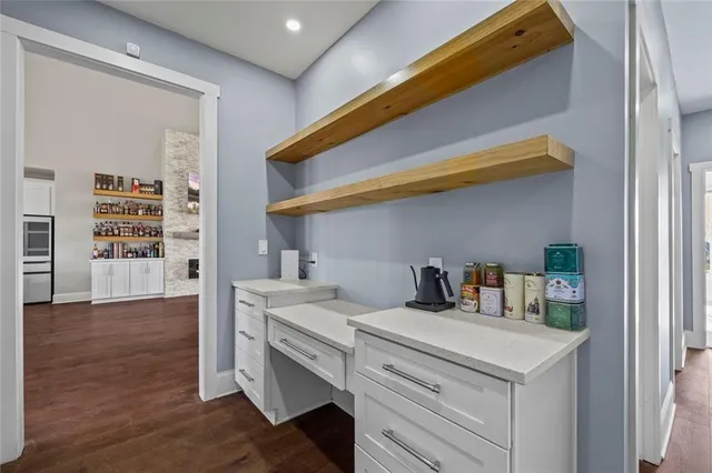 a spacious bedroom with a bed and a window