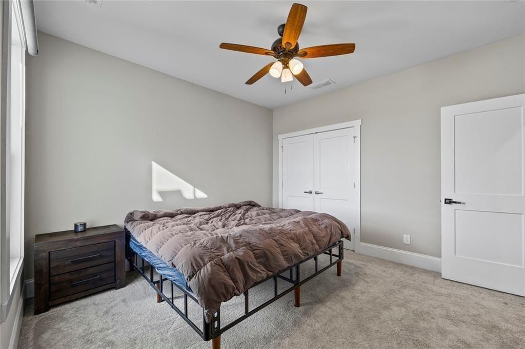 7588 Highway 98 Commerce, GA 30530 - Photo 26 of 50 a bedroom with a bed and a ceiling fan