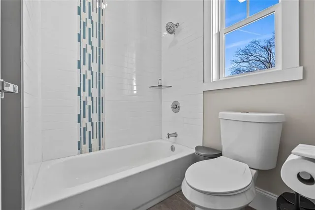 a utility room with sink dryer and washer