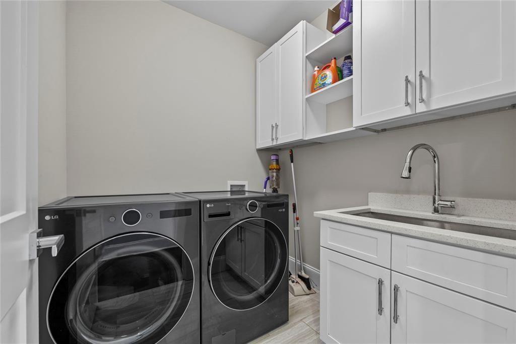 7588 Highway 98 Commerce, GA 30530 - Photo 29 of 50 a utility room with sink dryer and washer