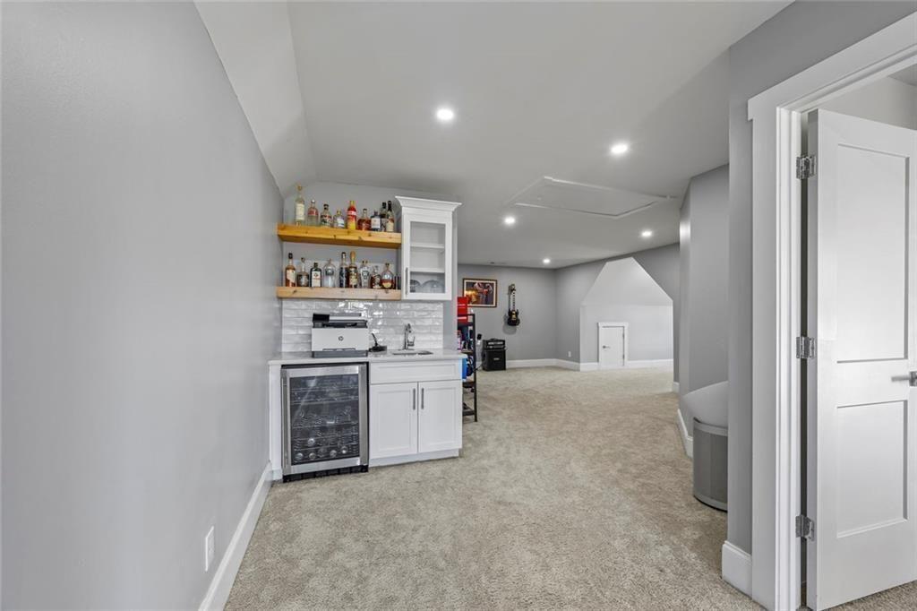 7588 Highway 98 Commerce, GA 30530 - Photo 32 of 50 a kitchen with stainless steel appliances granite countertop a refrigerator and a stove top oven