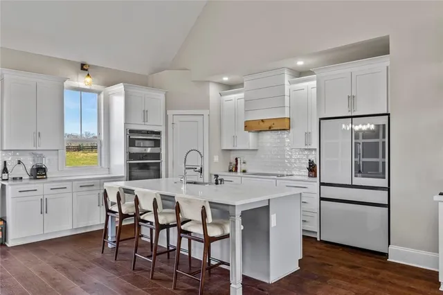 a view of a kitchen and dining room