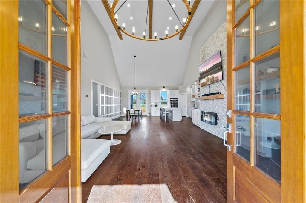 7588 Highway 98 Commerce, GA 30530 - Photo 7 of 50 a very nice looking living room with a large window and wooden floor