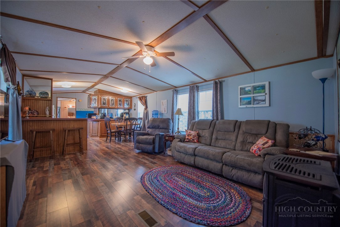 1848 West Mill Creek Road Warrensville, NC 28693 - Photo 10 of 50 a living room with furniture and a wooden floor
