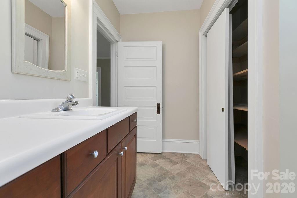 208 West Probart Street Brevard, NC 28712 - Photo 34 of 48 a bathroom with a sink and a mirror