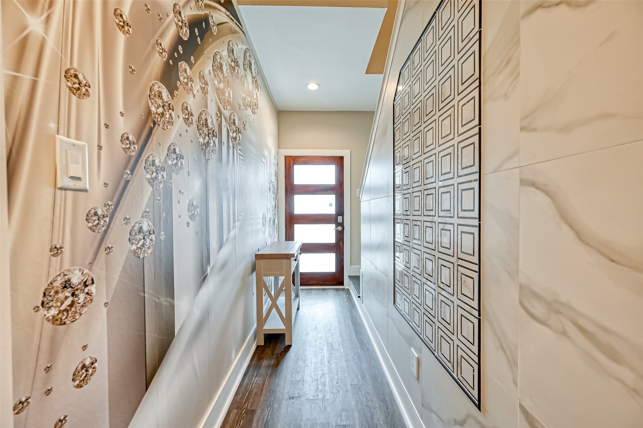 882 Fortune Street Houston, TX 77088 - Photo 2 of 18 a view of a hallway with wooden floor and staircase