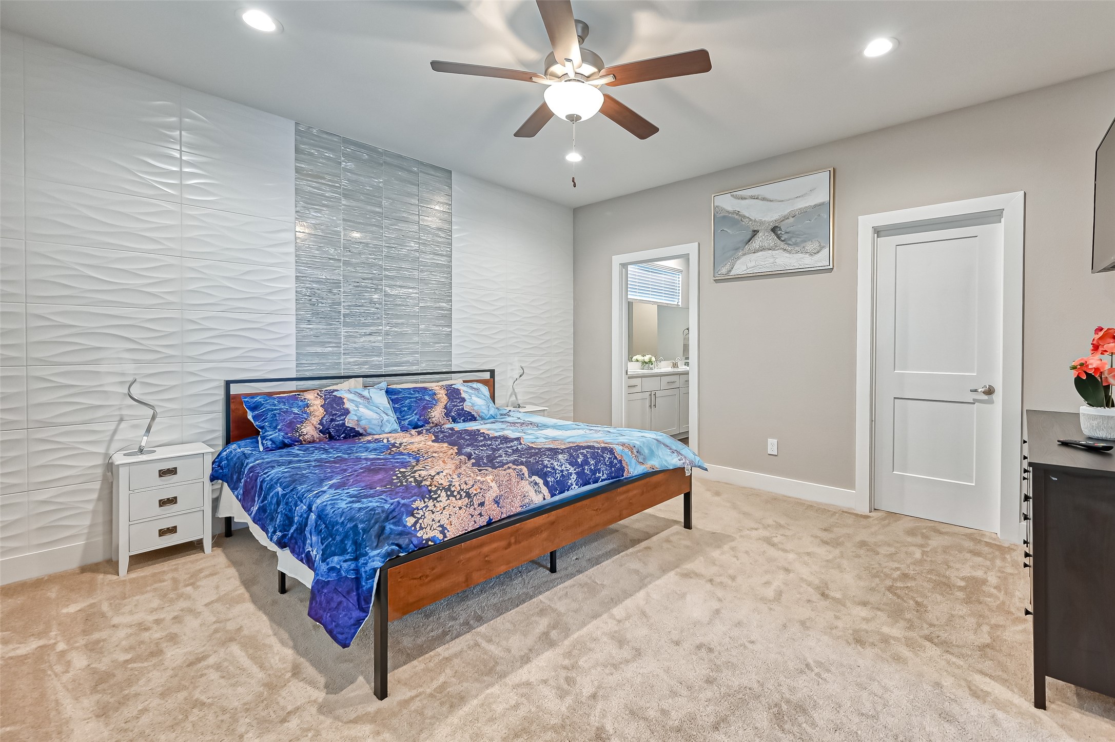 882 Fortune Street Houston, TX 77088 - Photo 3 of 18 a bed sitting in a spacious bedroom next to a window and a chandelier