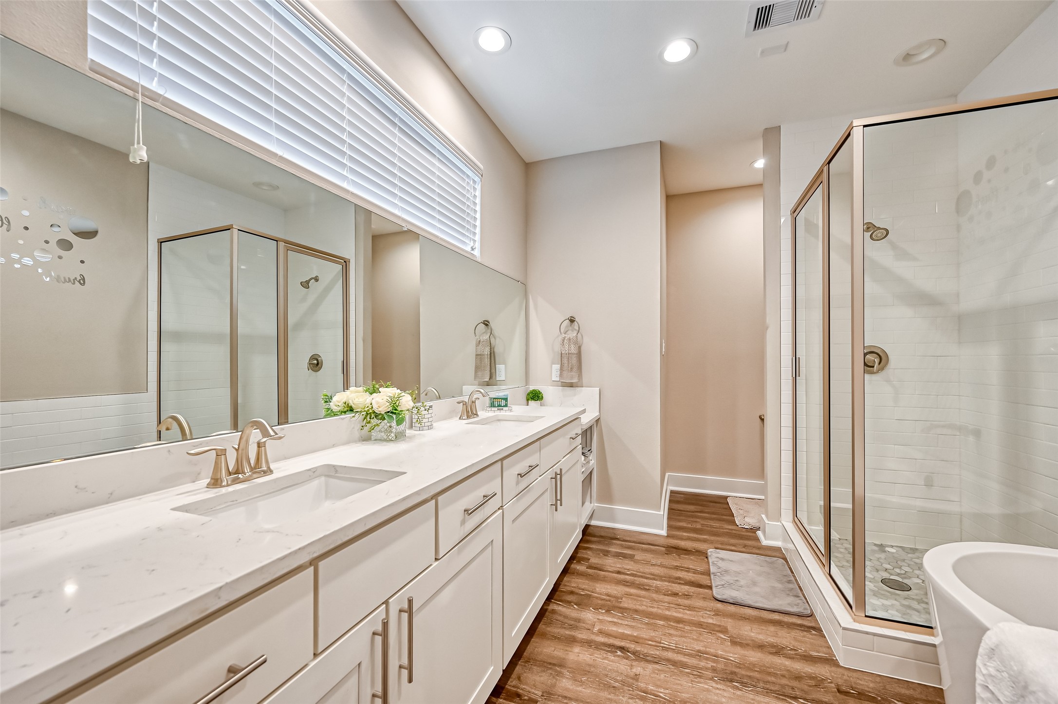 882 Fortune Street Houston, TX 77088 - Photo 4 of 18 a bathroom with a double vanity sink and a mirror