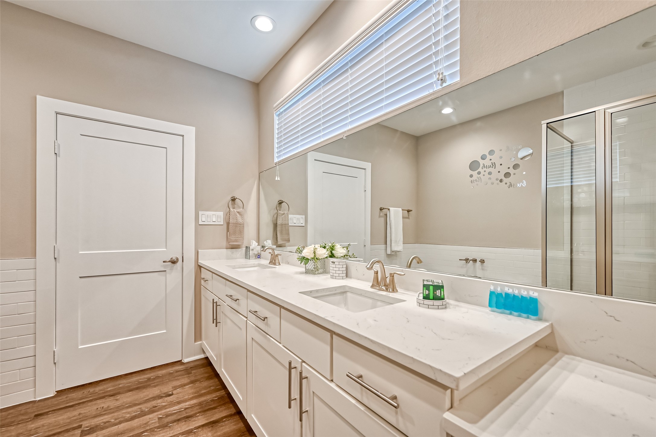 882 Fortune Street Houston, TX 77088 - Photo 7 of 18 a bathroom with a sink a mirror and a shower