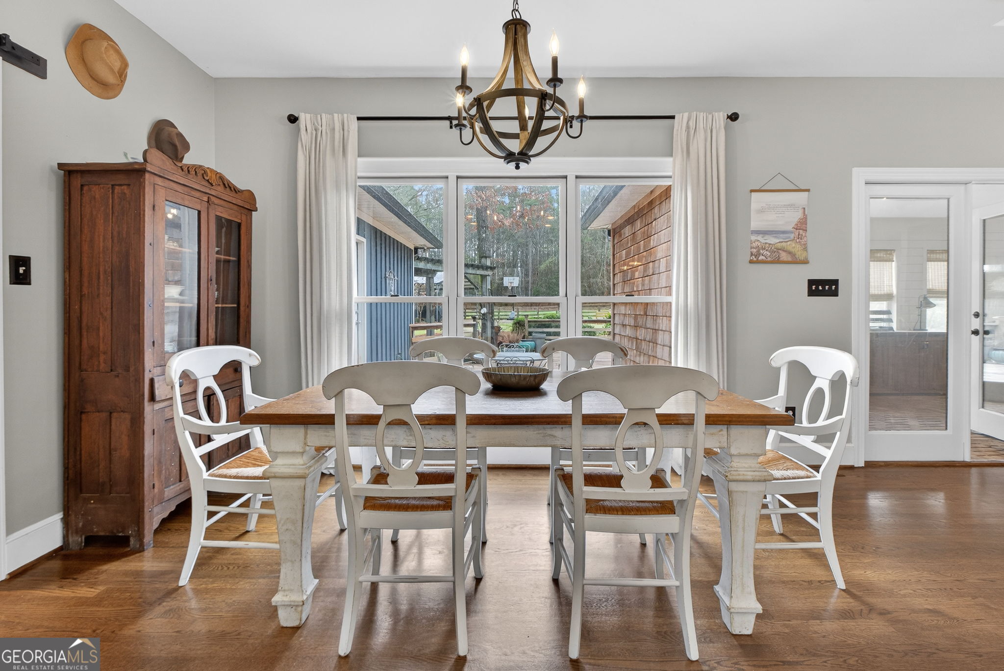 7581 Old Zebulon Road Molena, GA 30258 - Photo 22 of 79 a view of a dining room with furniture wooden floor and chandelier