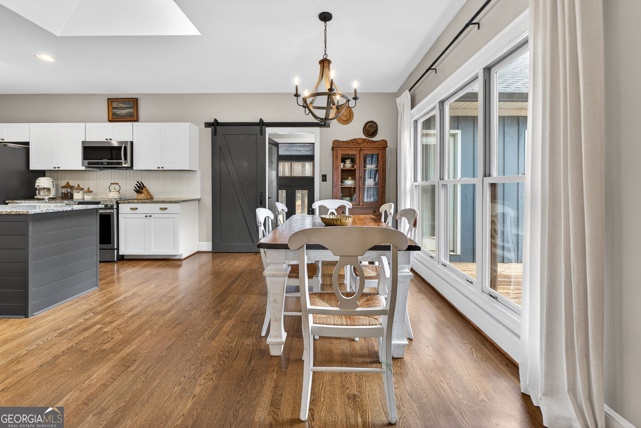 7581 Old Zebulon Road Molena, GA 30258 - Photo 23 of 79 a view of a dining room with furniture window and wooden floor