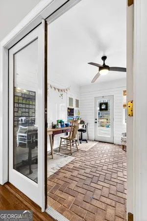 a bedroom with a bed and a television