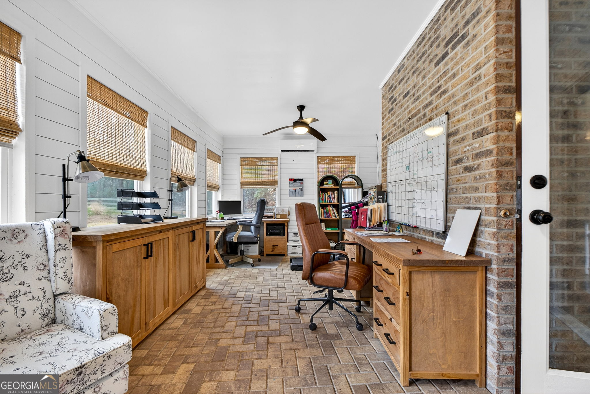 7581 Old Zebulon Road Molena, GA 30258 - Photo 26 of 79 a view of a workspace with furniture and a kitchen