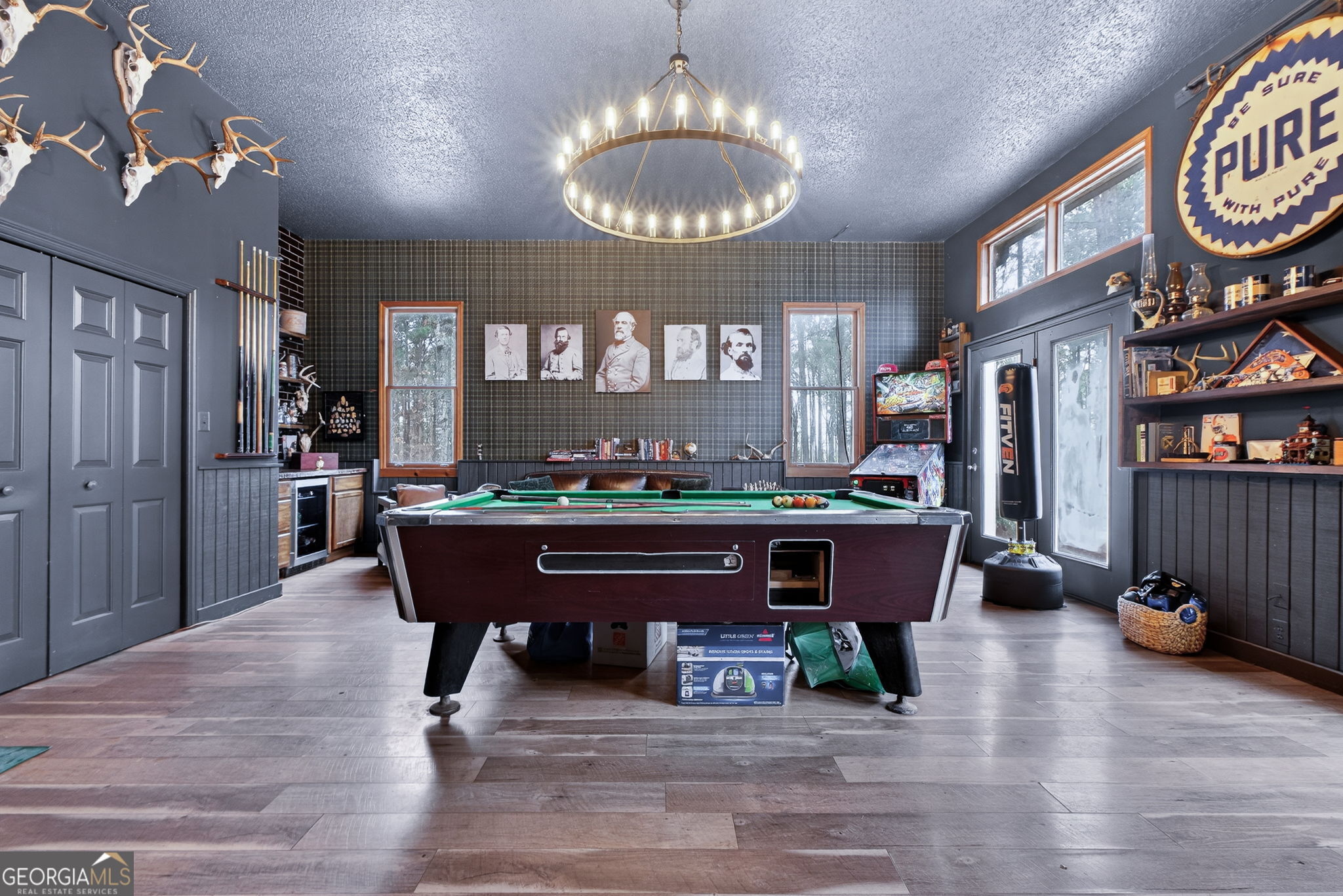 7581 Old Zebulon Road Molena, GA 30258 - Photo 28 of 79 a view of a dining room with furniture a chandelier and wooden floor