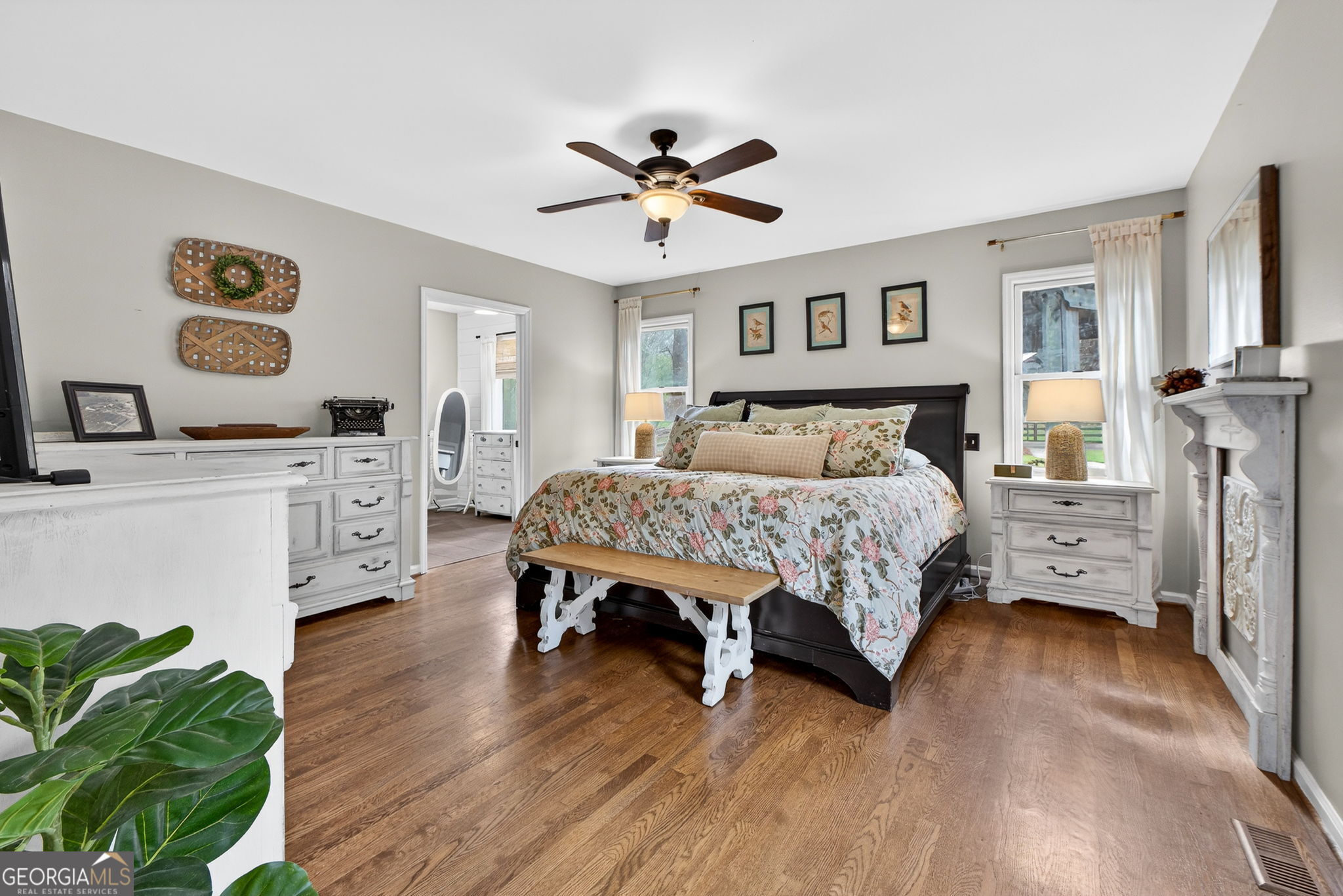 7581 Old Zebulon Road Molena, GA 30258 - Photo 32 of 79 a bedroom with a bed and a chandelier