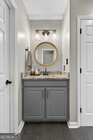 a kitchen with stainless steel appliances granite countertop a stove and a microwave