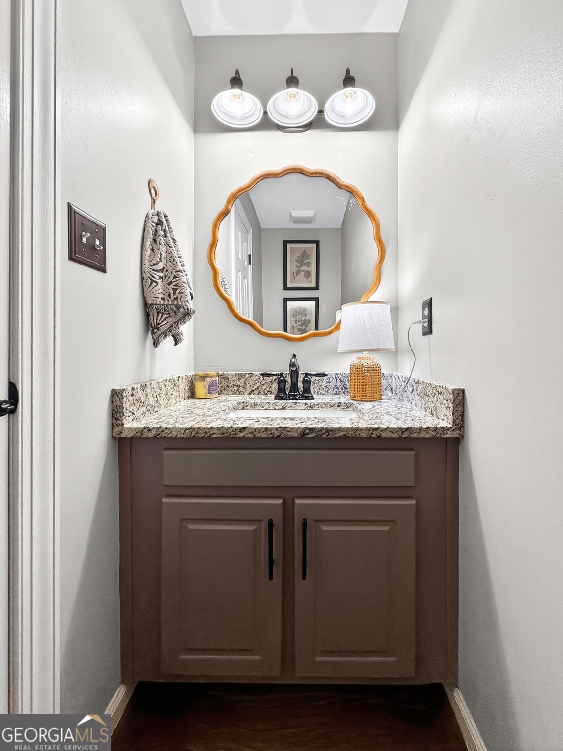7581 Old Zebulon Road Molena, GA 30258 - Photo 39 of 79 a bathroom with a sink and a mirror