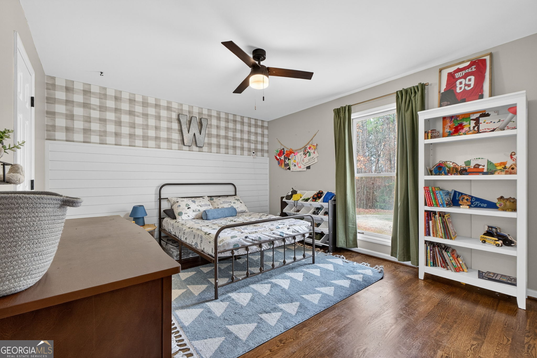 7581 Old Zebulon Road Molena, GA 30258 - Photo 40 of 79 a bedroom with furniture and a book shelf