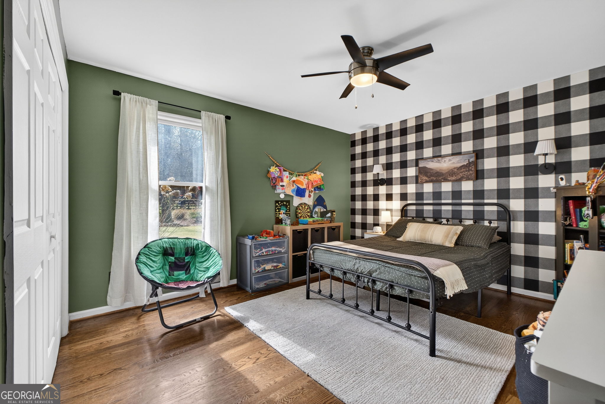 7581 Old Zebulon Road Molena, GA 30258 - Photo 46 of 79 a bedroom with a bed and a chandelier