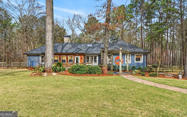 a view of living room with furniture and a chandelier