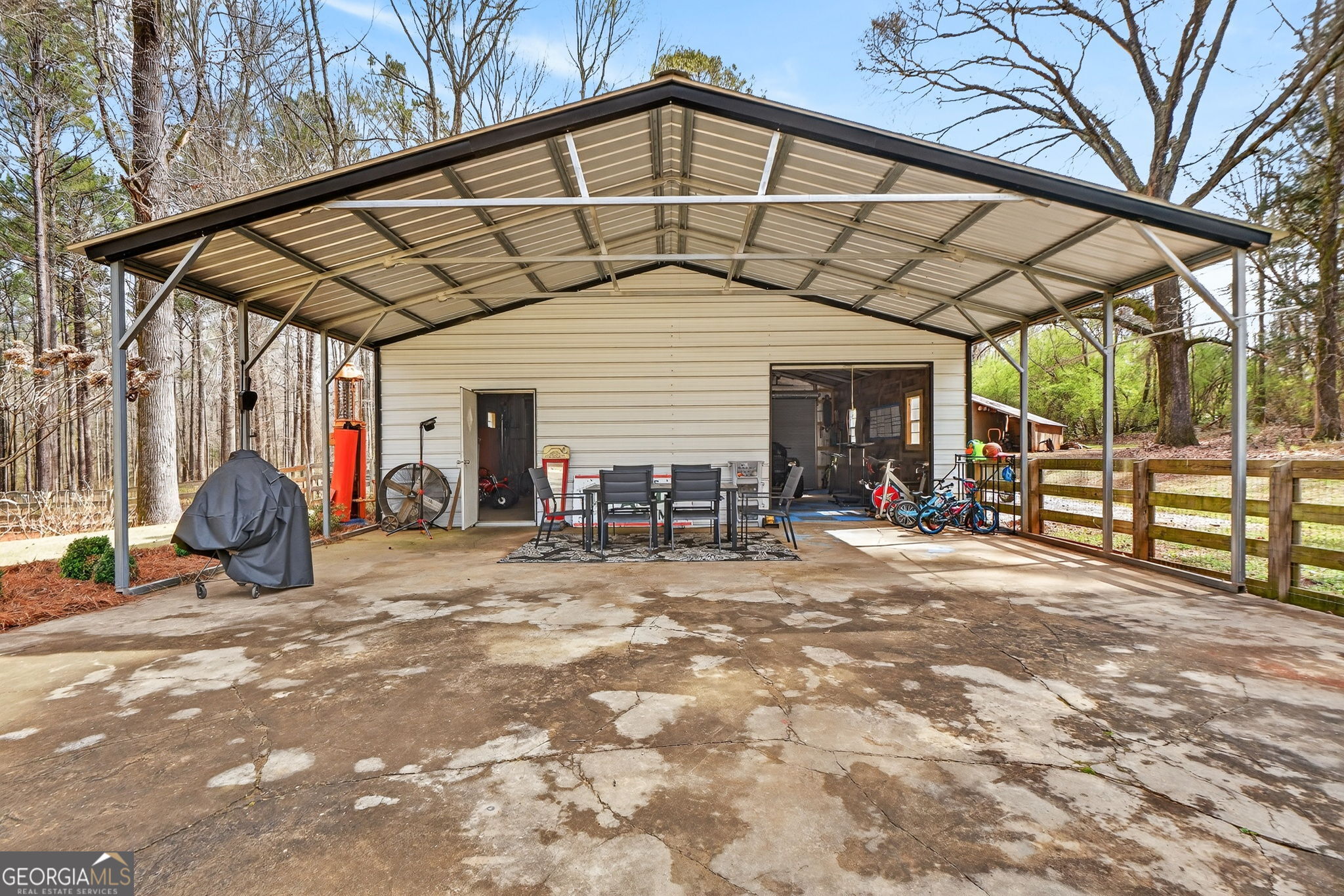 7581 Old Zebulon Road Molena, GA 30258 - Photo 59 of 79 a view of a house with backyard porch and sitting area