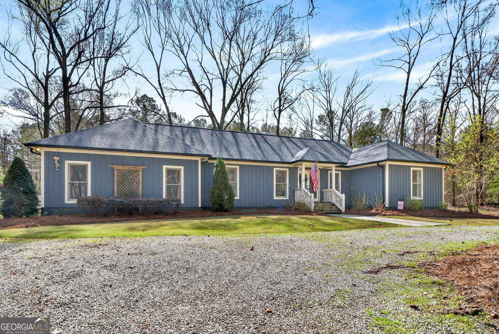 7581 Old Zebulon Road Molena, GA 30258 - Photo 67 of 79 a front view of a house with a yard and trees